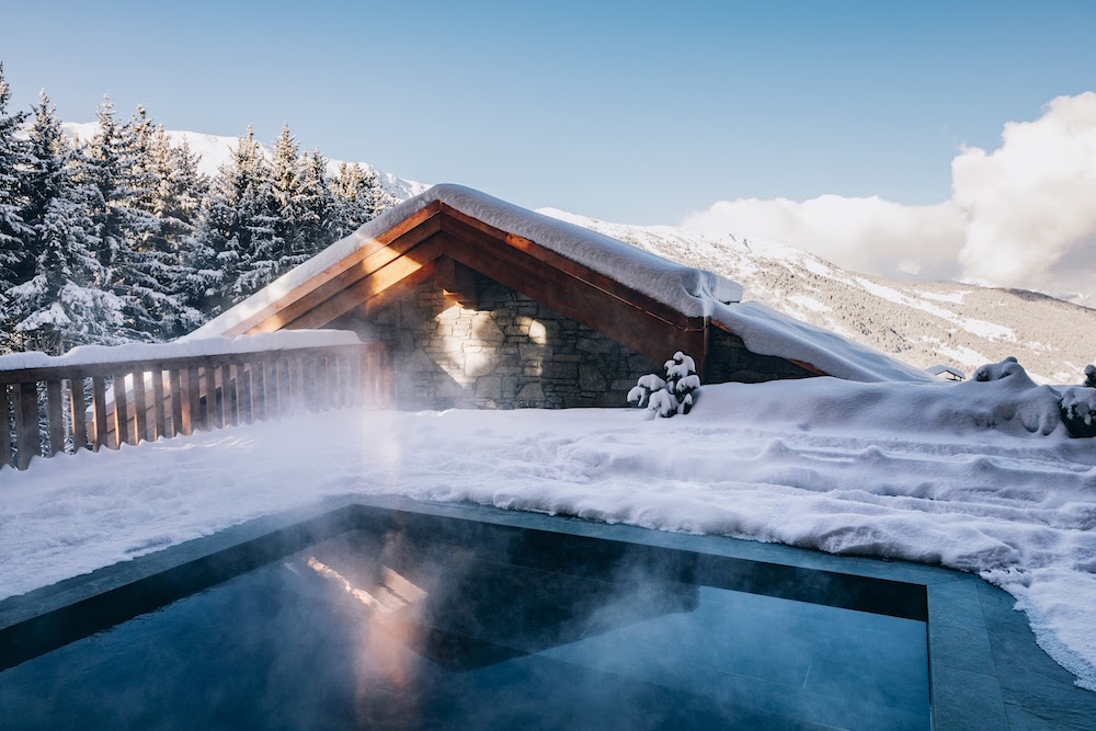 Pool overlooking snowy slopes