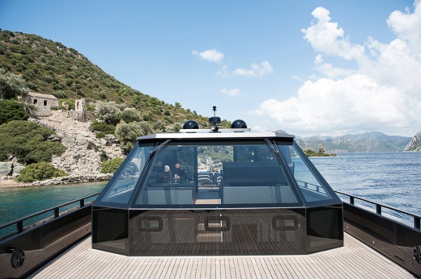 mazu's 82ft yacht combines an angular profile with cozy, home-like interiors designboom