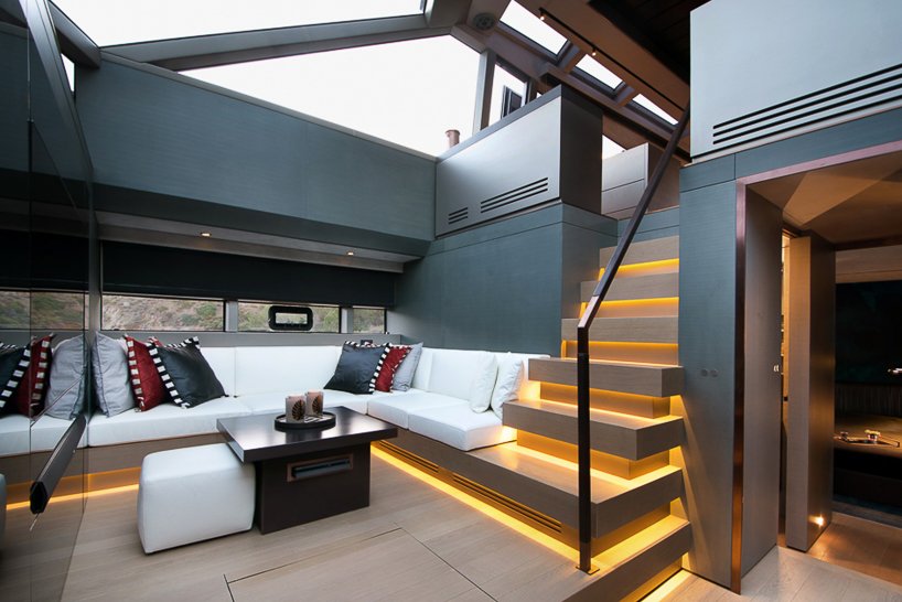 mazu's 82ft yacht combines an angular profile with cozy, home-like interiors designboom